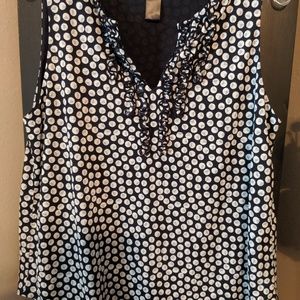 Sleeveless navy and white ruffle polka dot top